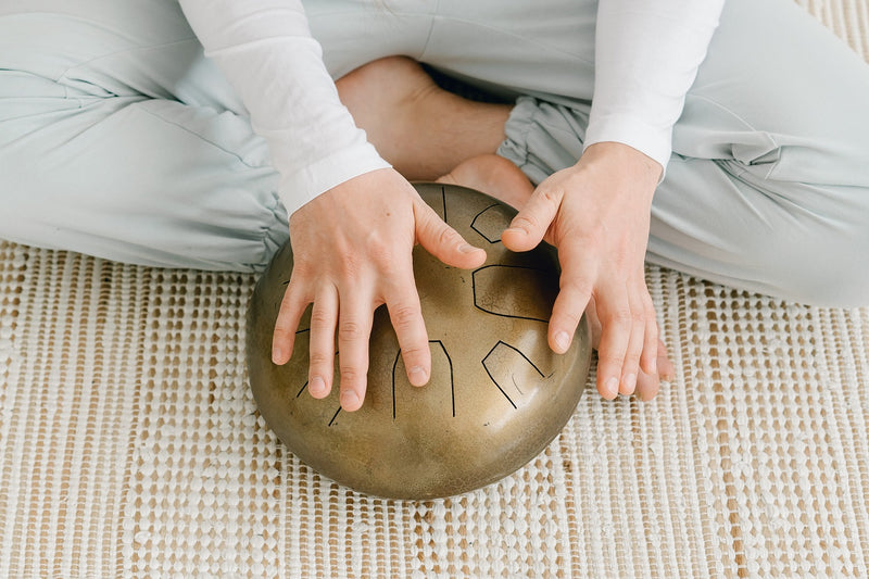 How do you meditate while playing a tongue drum?