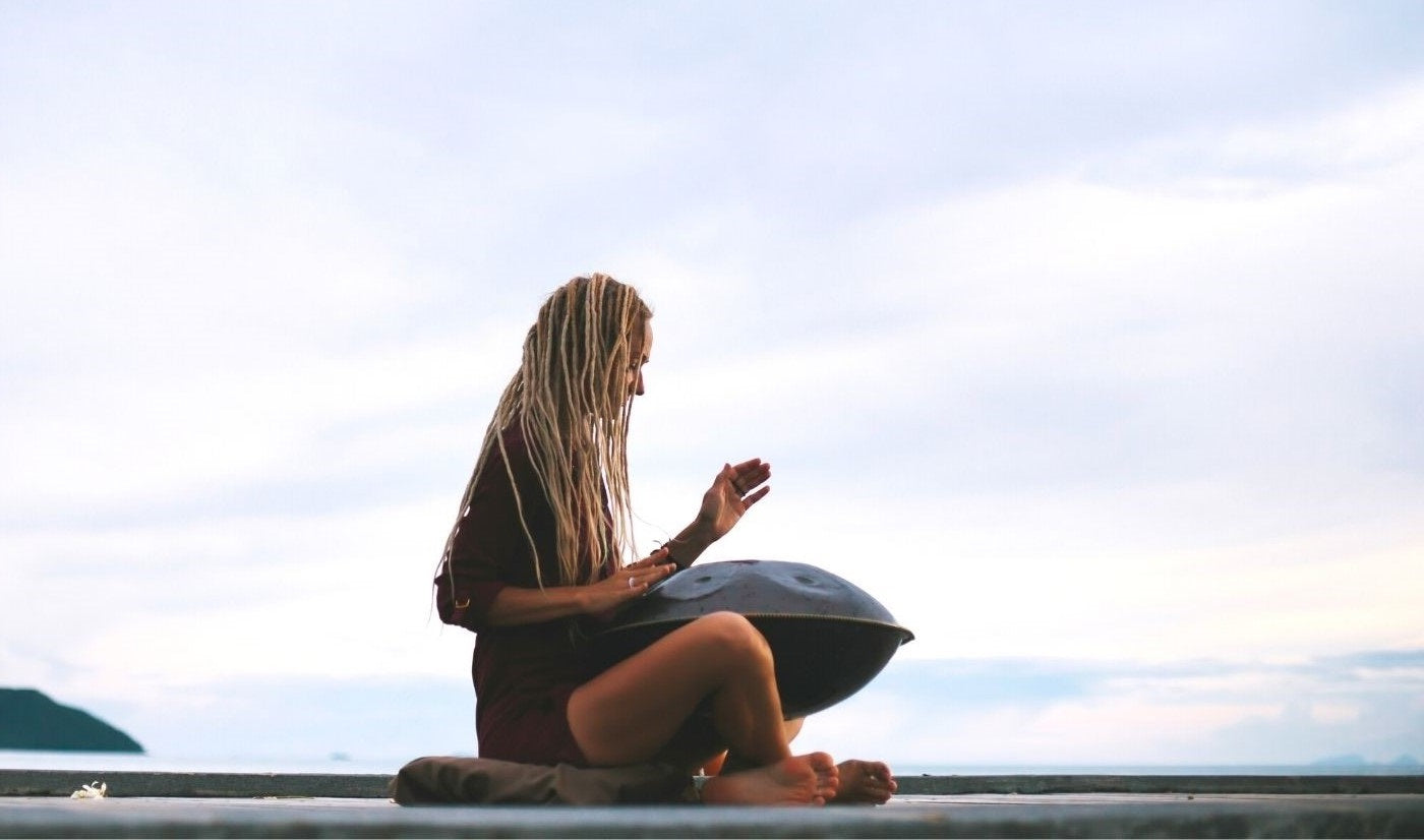 handpan music therapy, woman playing handpan, hang drum, instrument